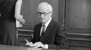 Dr. Sidney Gottlieb sitting at a desk in 1977.